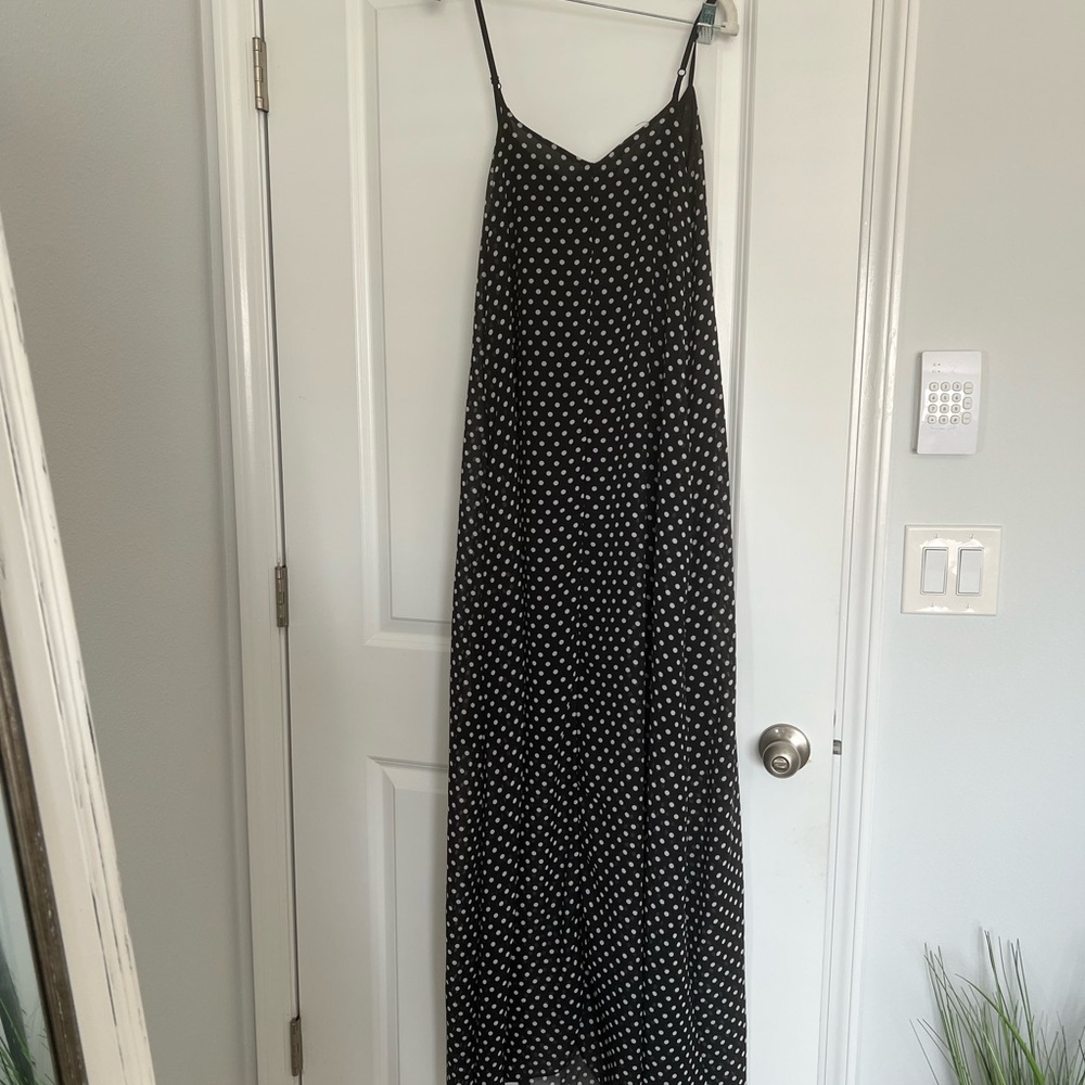 Black and White Polka Dot Maxi dress with half lining and pockets.